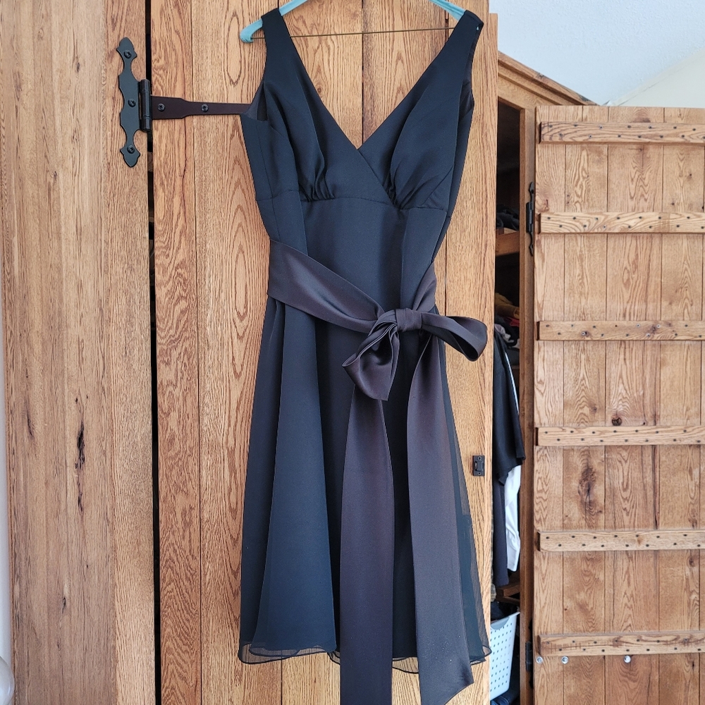 Da Vinci black cocktail dress with attached waist sash. Matching bolero jacket.